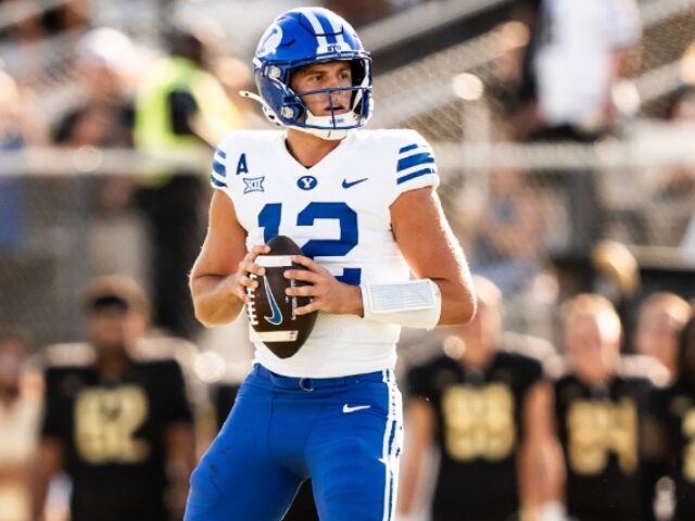 Conor Kvatek_UCF Athletics_University Images via Getty Images ORLANDO, FLORIDA - OCTOBER 26: Jake Retzlaff #12 of the Brigham Young Cougars looks to pas