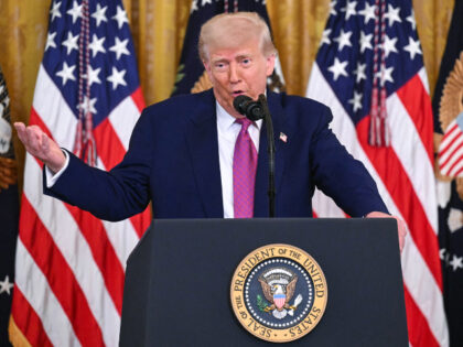 US President Donald Trump speaks before signing a bill blocking California's rule ban
