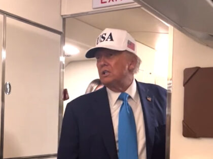President Donald Trump takes questions from the press aboard Air Force One on Friday, June