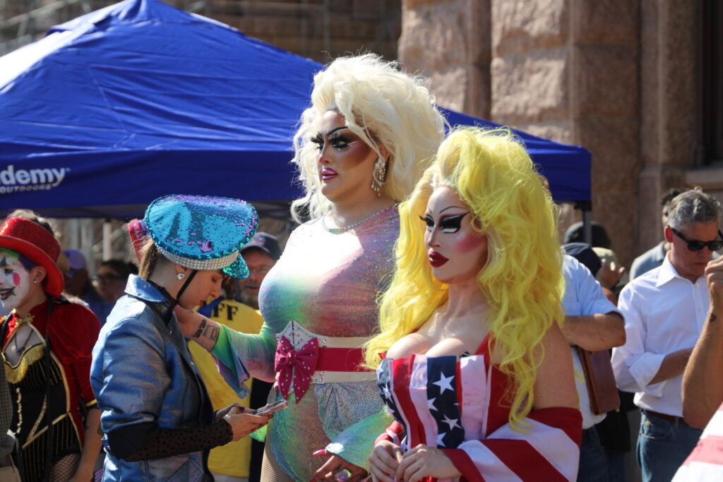 Drug Queens Surrounds Democrat Doggets when talking to crowds (Randy Clark/Breitbart Texas)