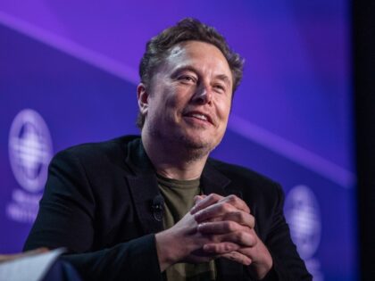 Elon Musk cracks a smile