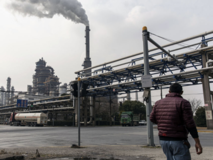 Smoke rises from a petrochemical production complex on the outskirts of Shanghai, China, o