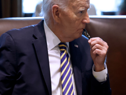 WASHINGTON, DC - SEPTEMBER 20: U.S. President Joe Biden listens to first lady Jill Biden s