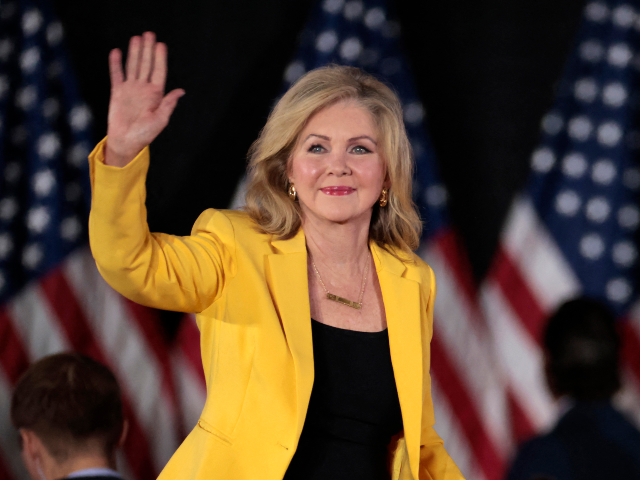 US Sen. Marsha Blackburn (R-TN) waves as she arrives for a town hall with former US Presid
