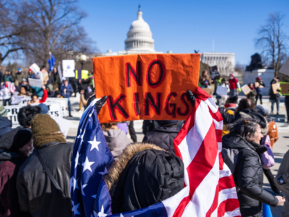 UNITED STATES - FEBRUARY 17: Demonstrators hold signs during the No Kings Day protest to o