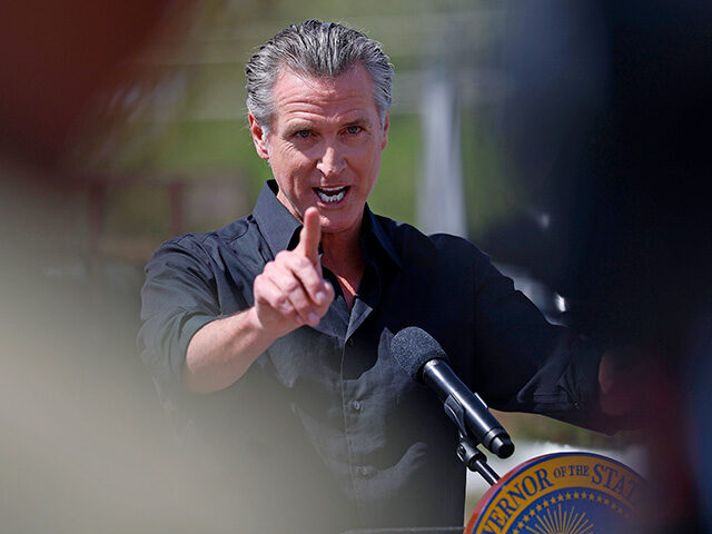 California Governor Gavin Newsom speaks during a news conference at Gemperle Orchard on Ap