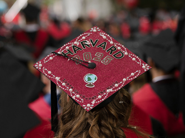 CAMBRIDGE, MASSACHUSETTS - MAY 29: A graduate's cap reads "Learn to Change the World" duri