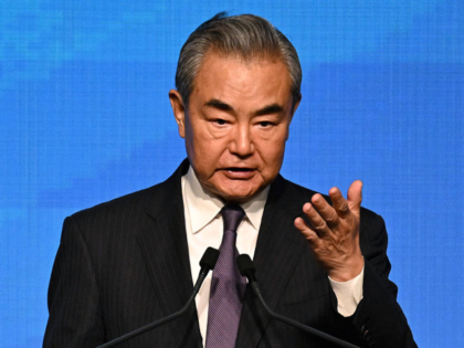 China's Foreign Minister Wang Yi speaks at the signing ceremony of the Convention on the E