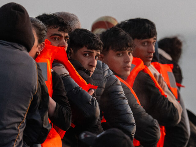 GRAVELINES, FRANCE - MAY 31: Migrants sit on a dinghy as they wait to sail into the Englis