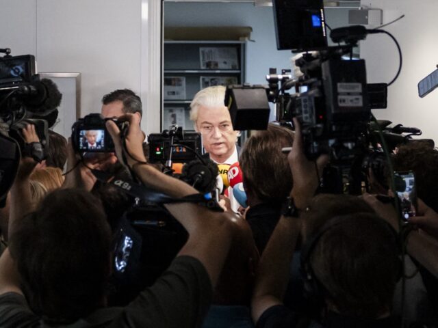 NETHERLANDS-POLITICS-PARTIES-PVV Dutch radical right party PVV leader Geert Wilders (C,R) addresses the media as he leaves