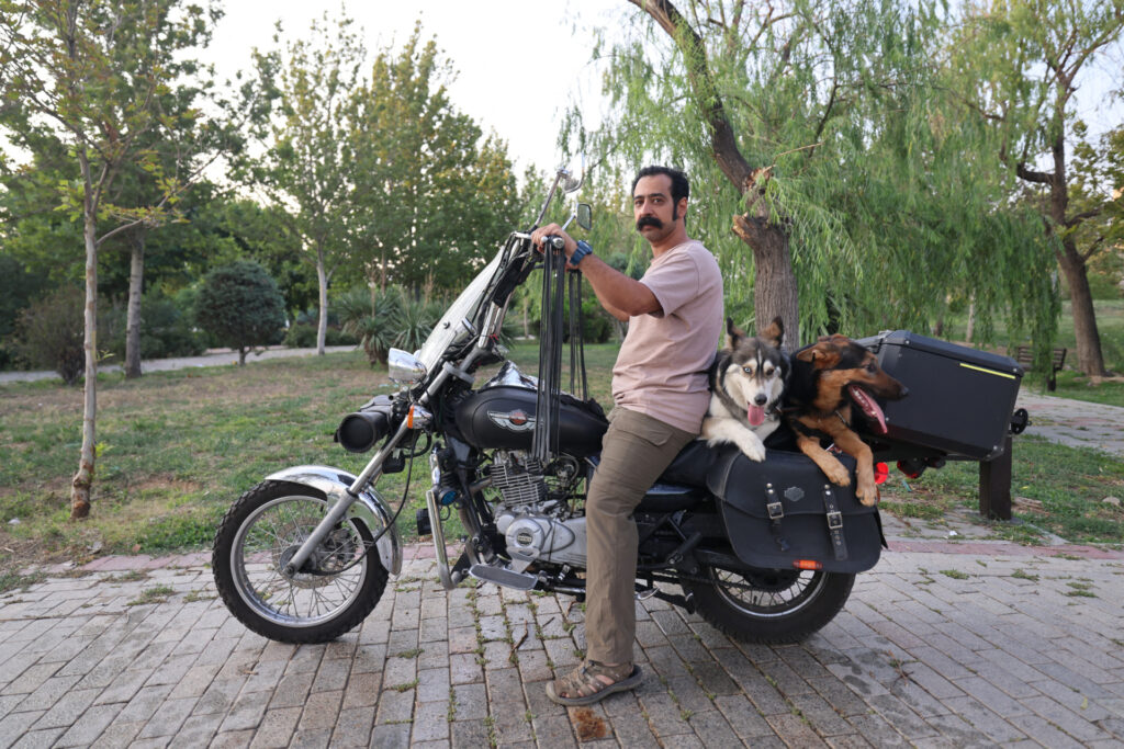 The Iranians arrived with a dog behind a motorcycle at a park in Tehran on June 8, 2025. Iranian authorities cite domestic media reported on June 8th, citing public dogs in multiple cities across the country, citing public health, social order and safety concerns. (Photo: Atta Kenare/AFP