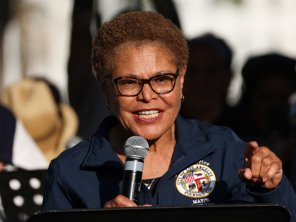 LA Mayor Karen Bass speaks at a prayer vigil in Grand Park as curfew goes in effect after