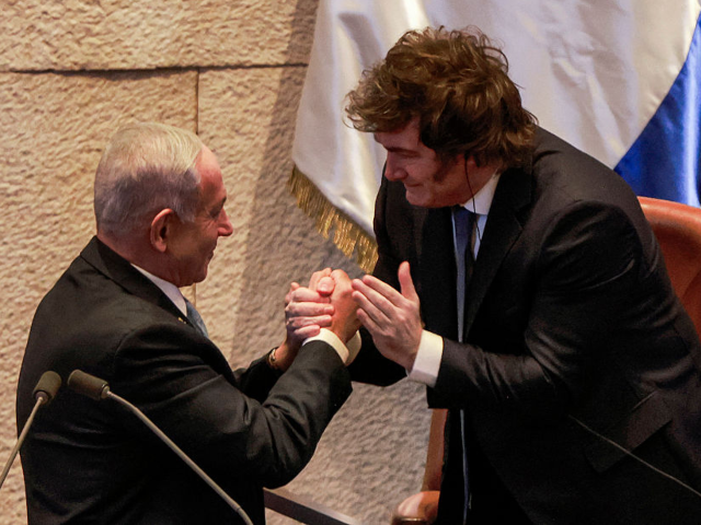 TOPSHOT - Argentina's President Javier Milei (R) shakes hands with Israel's Prime Minister