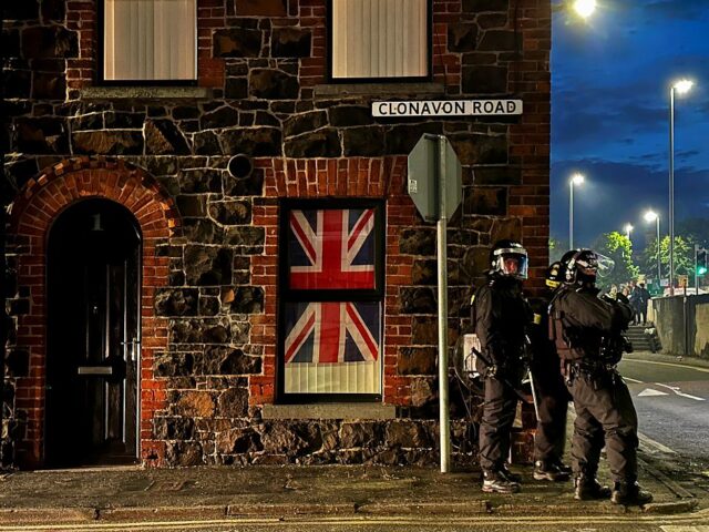 Police officers on Clonavon Road in Ballymena following a second night of violence in Ball