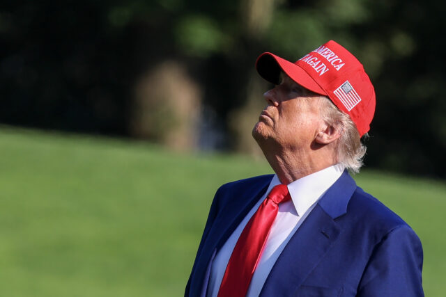 President Trump Returns To Washington On Saturday WASHINGTON, DC - JUNE 21: U.S. President Donald Trump looks up at the new flag on the sout