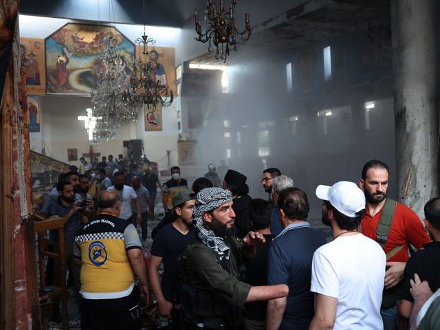 DAMASCUS, SYRIA - JUNE 22: People work at the site of the blast at the Mar Elias Church on