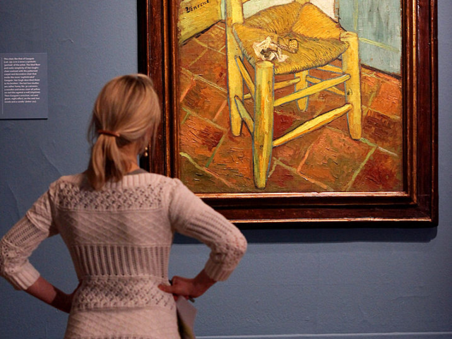 LONDON, ENGLAND - JANUARY 19: A woman admires an oil painting by acclaimed Dutch artist Vi