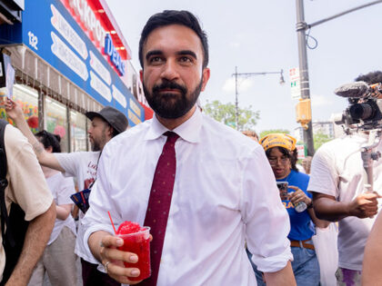 Zohran Mamdani, New York City mayoral candidate, holds a shaved ice during a campaign even