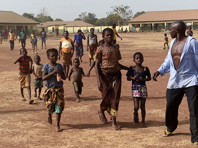 People walk at the internally displaced people camp occupied largely by women and children