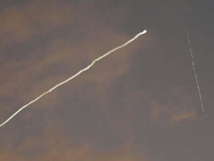 Iran missile and Iron Dome (Associated Press)