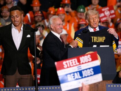 WEST MIFFLIN, PENNSYLVANIA - MAY 30: President Donald Trump receives a Pittsburgh Steeler