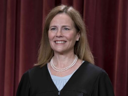 Associate Justice Amy Coney Barrett joins other members of the Supreme Court as they pose