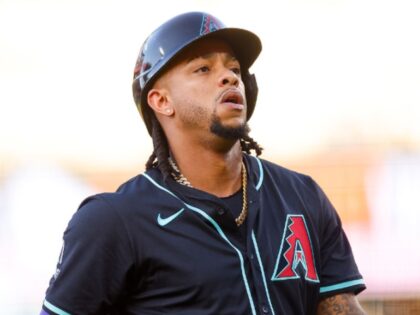 DENVER, CO - JUNE 21: Ketel Marte #4 of the Arizona Diamondbacks walks off the field in t