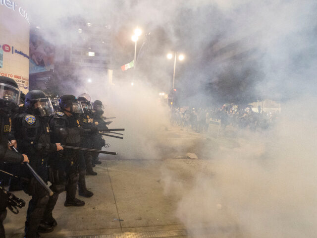 Los Angeles Riot Police officers in riot clash with demonstrators during a protest following federal immigr