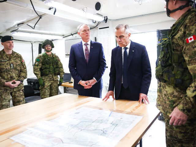 Canadian Prime Minister Mark Carney, right, and Minister of National Defence David McGuint