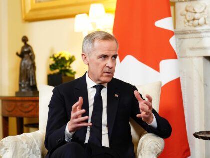 Canada's Prime Minister Mark Carney talks during a meeting with Britain's Prime