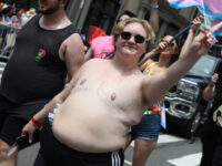 Leftist Pride: Shirtless Women with Scruff and Scars, Men with Bare Breast Implants, Signs Reading 