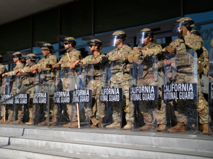 California National Guard stand in formation guarding the federal building in downtown Los