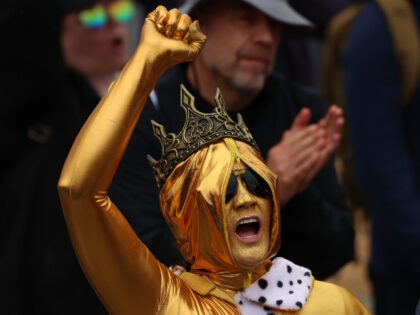 A woman, who identified herself only as Stephanie, demonstrates during the "No Kings&