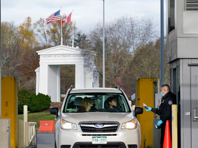 Northern border A U.S. Customs and Border Protection officer checks identification on a driver and passeng
