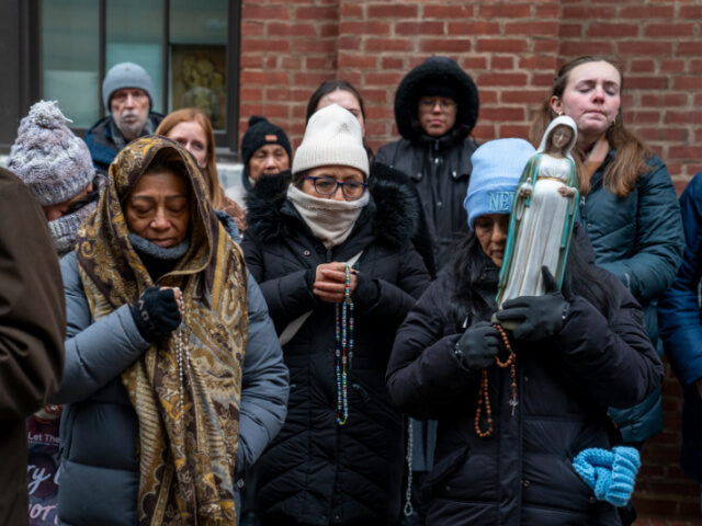 People Pray Outside Abortion Clinic Anti-abortion activists hold their rosaries during a prayer in front of a Planned Parentho