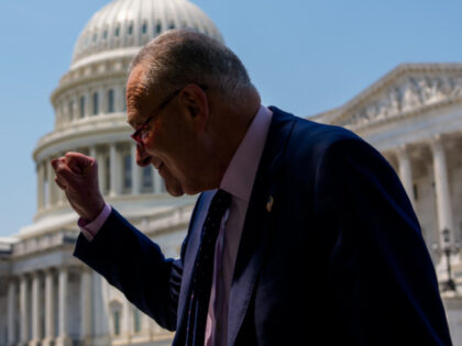 The Dome of the U.S. Capitol Building is visible as Senate Minority Leader Chuck Schumer (