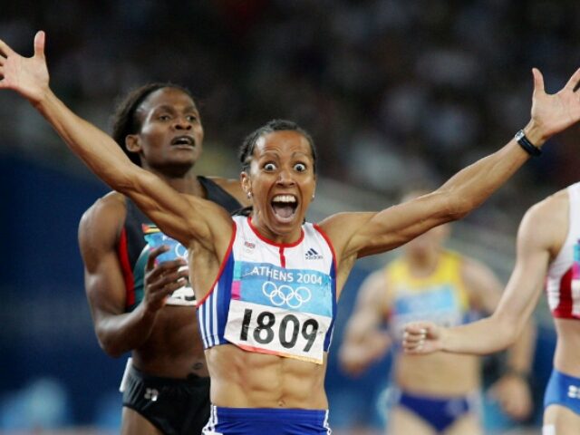 Stu Forster_Getty Images ATHENS - AUGUST 23: Kelly Holmes of Great Britain celebrates after she won gold in the wo