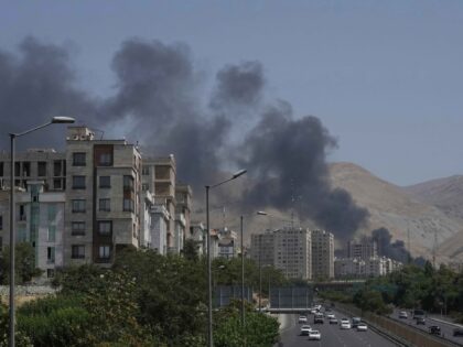 Smoke rises from an oil storage facility after it appeared to have been struck by an Israe