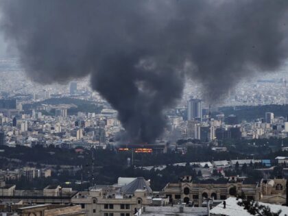 TEHRAN, IRAN - JUNE 16: Smoke rises after a reported Israeli strike on a building used by