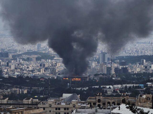 TEHRAN, IRAN - JUNE 16: Smoke rises after a reported Israeli strike on a building used by