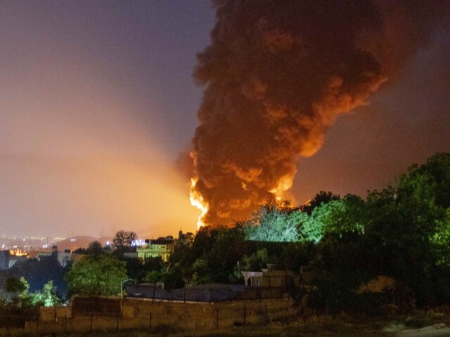Tehran explosion (Stringer / Getty) TEHRAN, IRAN - JUNE 15: Fire and smoke rise into the sky after an Israeli attack on the Sh