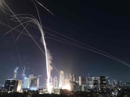 Israeli Iron Dome air defense system fires to intercept missiles over Tel Aviv, Israel, Fr