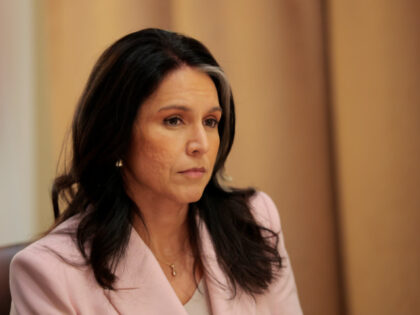 Director of National Intelligence Tulsi Gabbard listens during a Cabinet meeting at the Wh