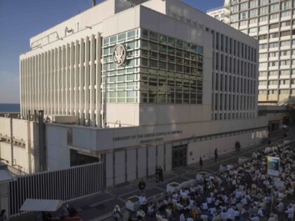 FILE - Activists sit in front of the U.S. Embassy branch office in Tel Aviv, Israel, durin