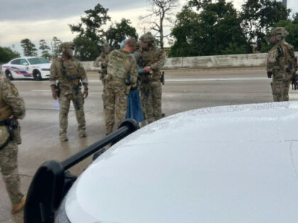 Woman with handgun on highway