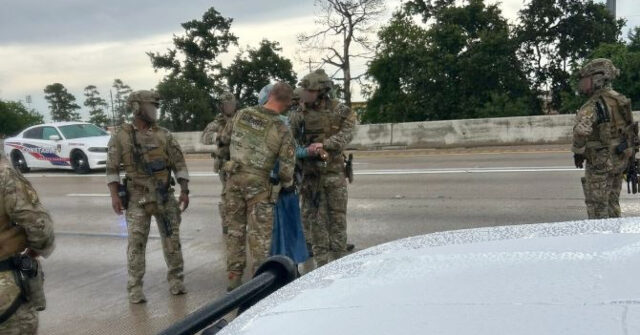 Woman With Handgun Sits in Lawn Chair in Middle of Texas Interstate