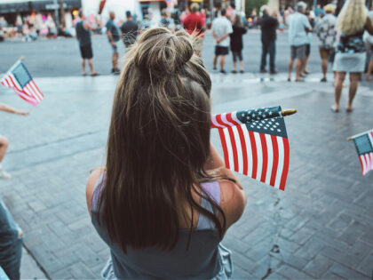 Girl Holding an American Flag