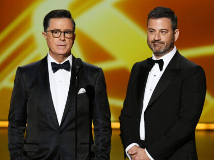 LOS ANGELES, CALIFORNIA - SEPTEMBER 22: (L-R) Stephen Colbert and Jimmy Kimmel speak onsta