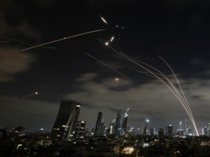 The Israeli Iron Dome air defense system fires to intercept missiles during an Iranian att