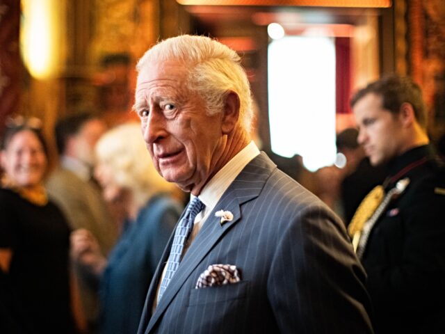 king charles LONDON, ENGLAND - JUNE 24: King Charles III reacts during a reception to celebrate 25 year